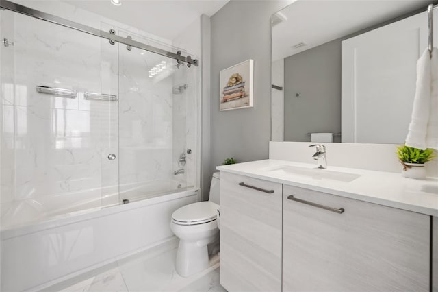 full bath featuring toilet, marble finish floor, combined bath / shower with glass door, and vanity