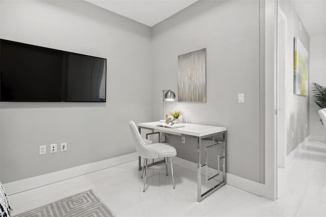 home office featuring light tile patterned floors and baseboards