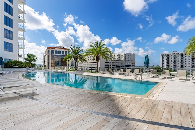 community pool with a patio area