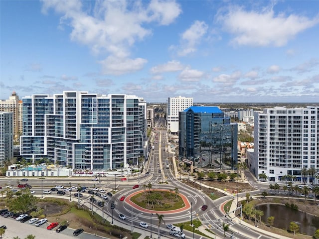 birds eye view of property featuring a city view