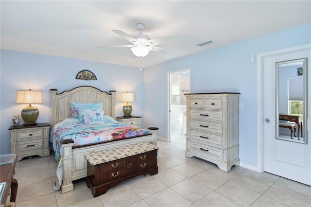 bedroom featuring light tile patterned floors, baseboards, ensuite bathroom, and a ceiling fan