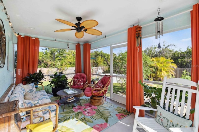 sunroom / solarium with a ceiling fan