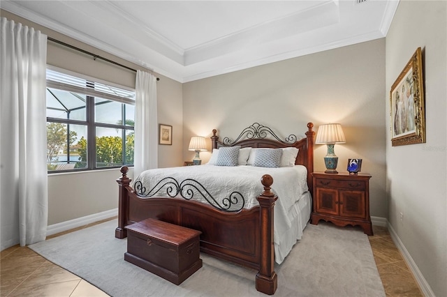 tiled bedroom featuring a tray ceiling, crown molding, and baseboards