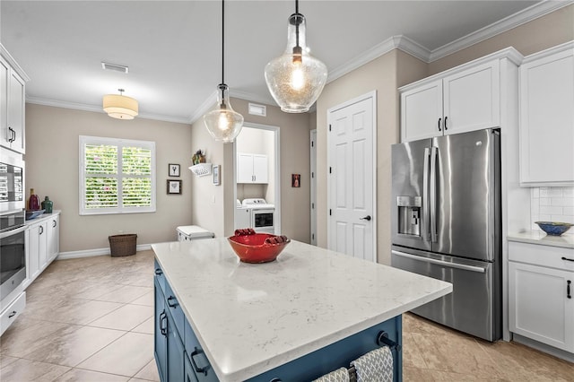 kitchen featuring visible vents, white cabinets, stainless steel appliances, and ornamental molding