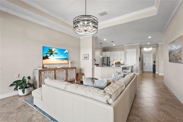 living room with tile patterned flooring, crown molding, baseboards, and visible vents