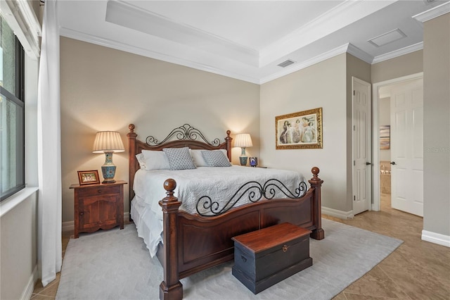 bedroom featuring visible vents, baseboards, ornamental molding, tile patterned flooring, and a raised ceiling