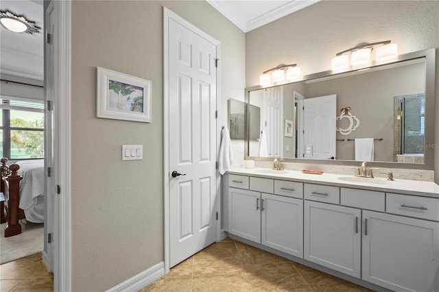 bathroom with a sink, ensuite bathroom, double vanity, and crown molding