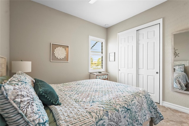 bedroom featuring a closet and baseboards