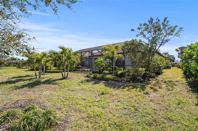 view of yard with a lanai