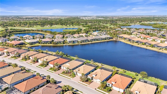 birds eye view of property featuring a residential view and a water view