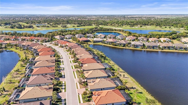 aerial view with a residential view and a water view