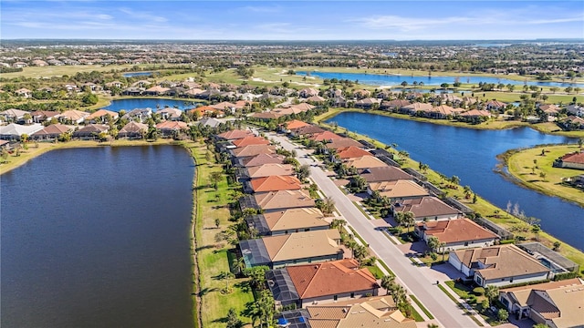 aerial view with a residential view and a water view