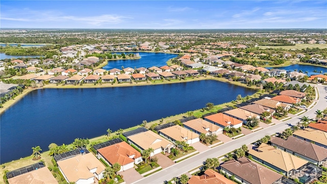 birds eye view of property with a residential view and a water view