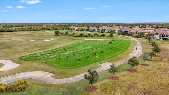 aerial view featuring view of golf course and a residential view