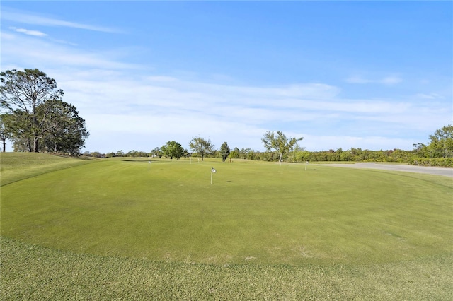 surrounding community featuring view of golf course