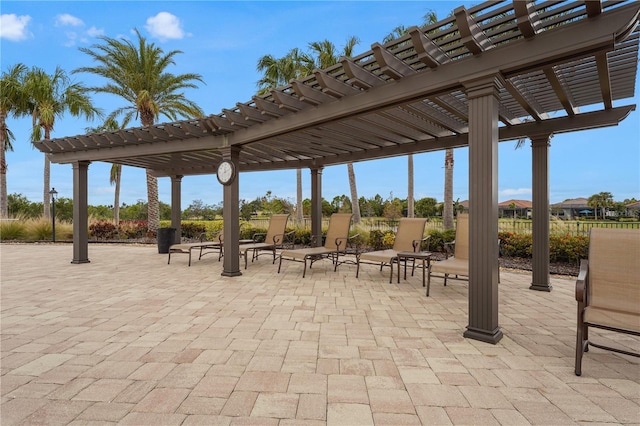 view of patio / terrace featuring a pergola and fence