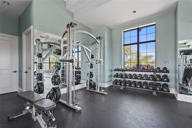 exercise room with a wealth of natural light and baseboards