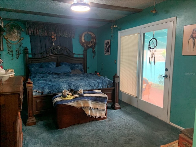 carpeted bedroom featuring a textured ceiling