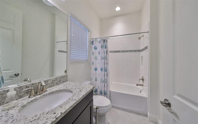 full bathroom featuring toilet, shower / bath combo with shower curtain, tile patterned floors, and vanity