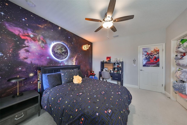 bedroom with baseboards, carpet flooring, and a ceiling fan