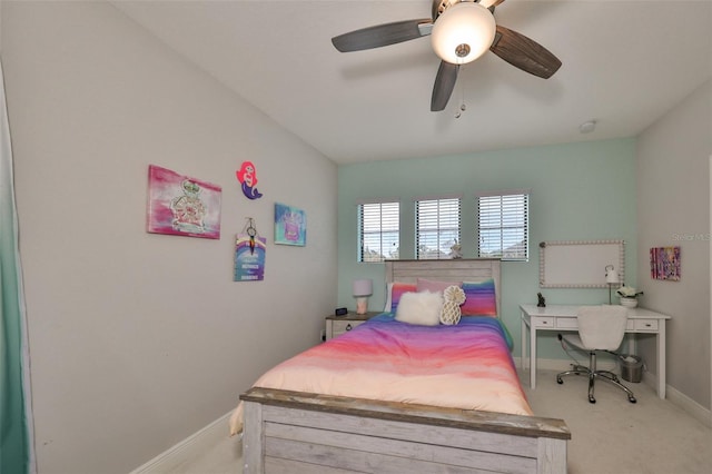 bedroom with a ceiling fan, carpet, and baseboards