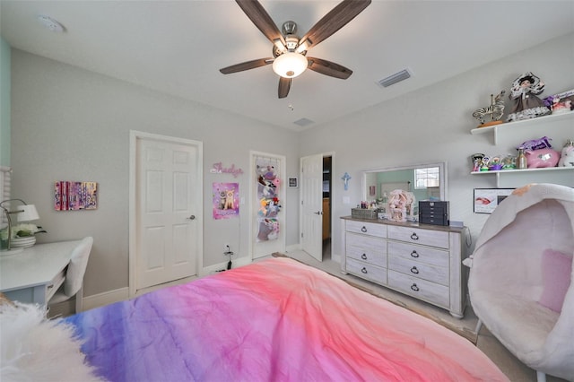bedroom featuring baseboards, ceiling fan, and visible vents
