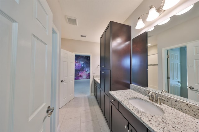 full bath with visible vents, tile patterned floors, and vanity