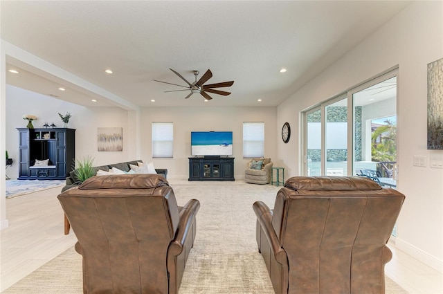 living room with ceiling fan, baseboards, and recessed lighting