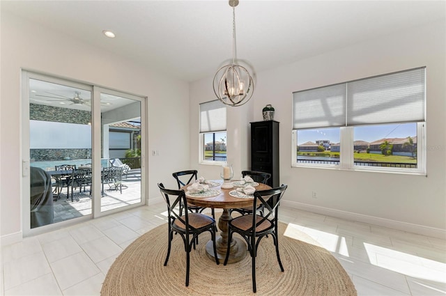 dining room featuring light tile patterned floors, baseboards, a chandelier, and recessed lighting