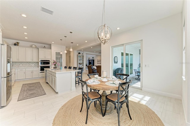 dining area with baseboards, visible vents, a chandelier, and recessed lighting