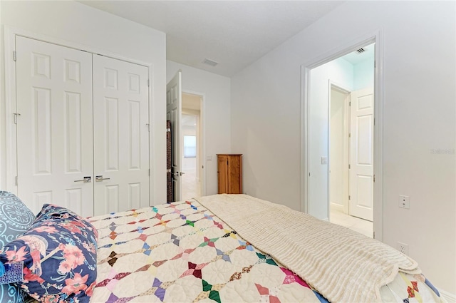 bedroom featuring visible vents and a closet