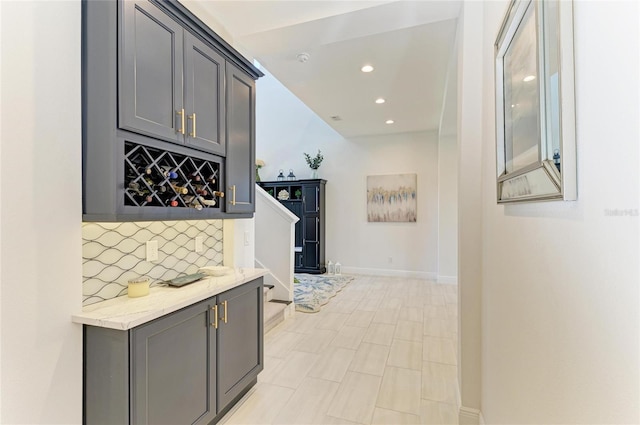 corridor featuring baseboards and recessed lighting