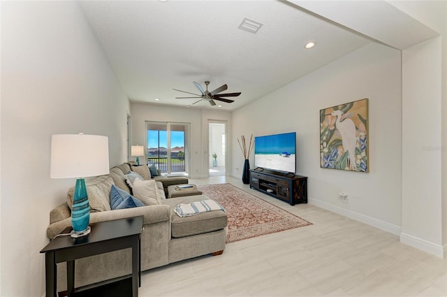 living room with baseboards, visible vents, ceiling fan, and recessed lighting