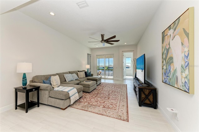 living room featuring recessed lighting, visible vents, ceiling fan, and baseboards