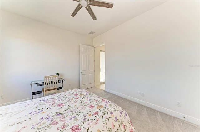 carpeted bedroom featuring a ceiling fan, visible vents, and baseboards