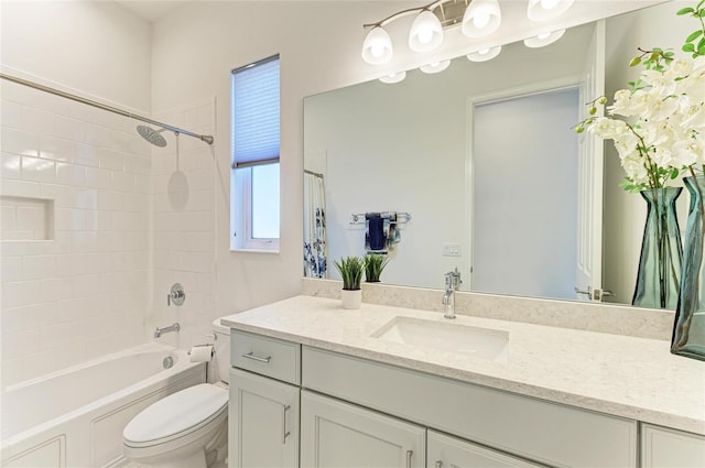 bathroom with shower / bath combination, vanity, and toilet