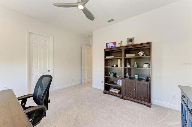 office with light colored carpet, ceiling fan, and baseboards