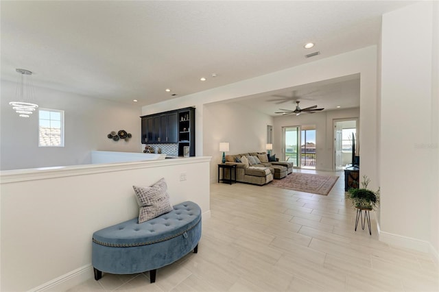 interior space with visible vents, baseboards, a wealth of natural light, and recessed lighting