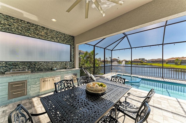 view of patio / terrace with ceiling fan, glass enclosure, outdoor dining area, area for grilling, and an outdoor pool