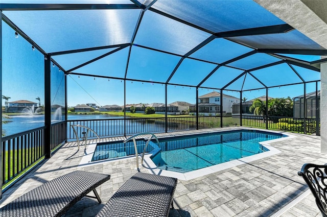 view of swimming pool featuring a lanai and a patio