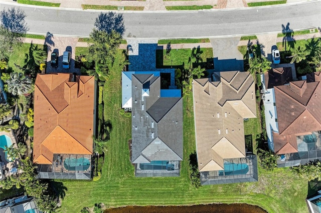 birds eye view of property with a residential view