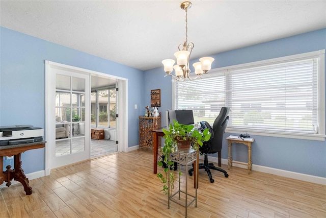 home office with an inviting chandelier, baseboards, and wood finished floors