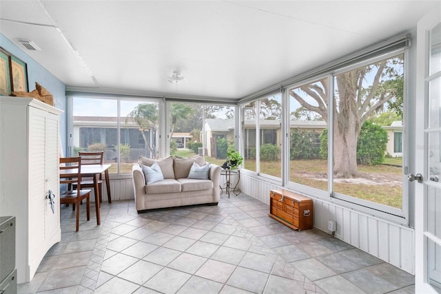 sunroom / solarium with a wealth of natural light and visible vents