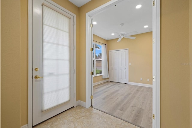 doorway to outside featuring a ceiling fan, recessed lighting, baseboards, and wood finished floors