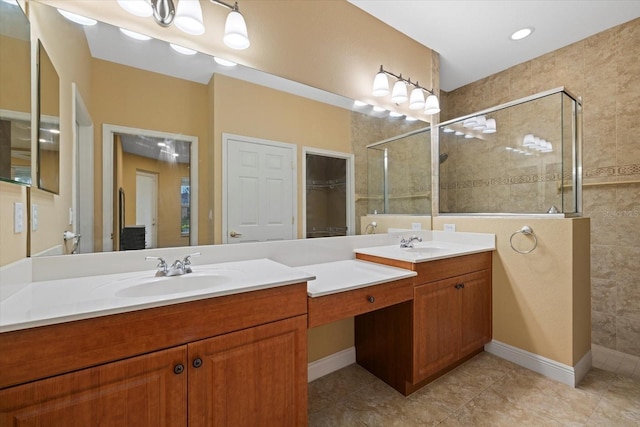 bathroom featuring tile patterned flooring, a closet, tiled shower, and vanity