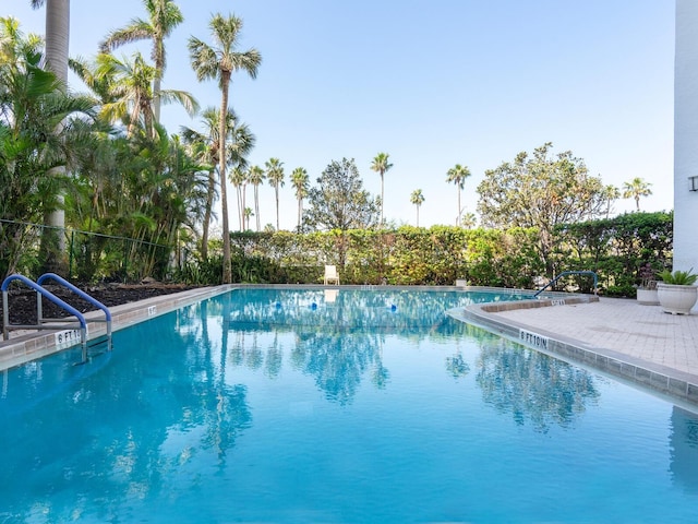 community pool with a patio area