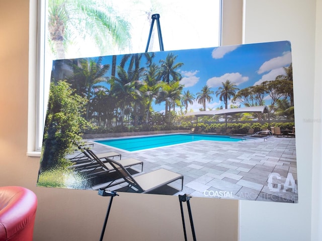 view of pool with a fenced in pool, a lanai, and a patio area