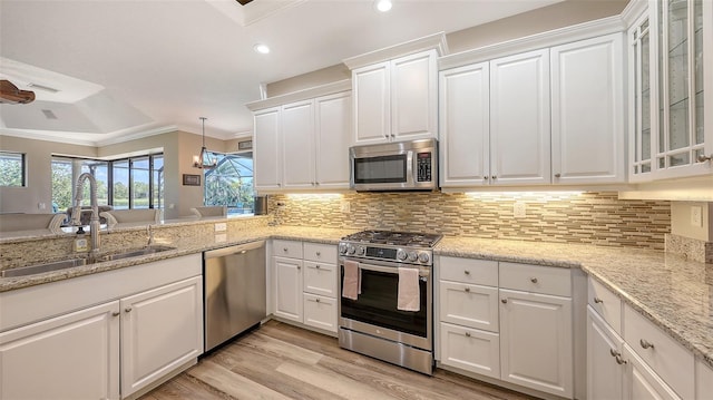 6621 The Masters Ave, Lakewood Ranch, FL 34202 - kitchen with appliances with stainless steel finishes, a sink, crown molding, white cabinetry, and recessed lighting