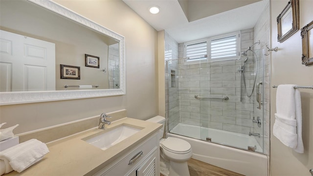 6621 The Masters Ave, Lakewood Ranch, FL 34202 - full bathroom with toilet, vanity, and shower / bath combination with glass door