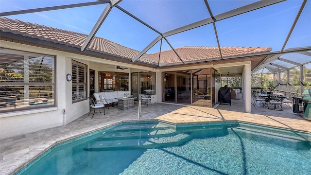 6621 The Masters Ave, Lakewood Ranch, FL 34202 - swimming pool featuring a ceiling fan, outdoor lounge area, a patio area, and glass enclosure